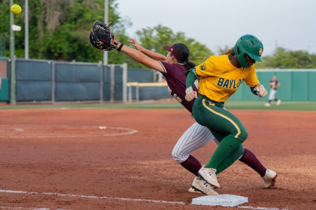11 makes it to first base ahead of the catch during Baylor softball’s 6-0 win over Texas State on Tuesday night at Getterman Stadium. Mary Thurmond | Photo Editor.