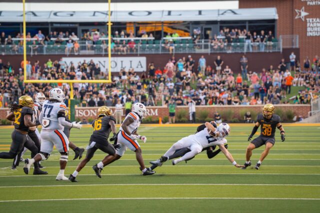 Junior offensive linebacker Matther Fobbs-White tackles quarterback Jackson Arnold during Baylor football's 38-24 loss against Auburn on Friday night at McLane Stadium. Sam Gassaway | Photographer