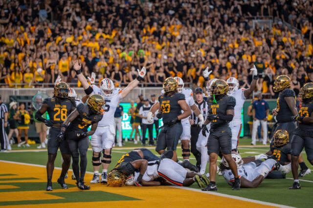 Auburn's offensive line celebrates after a touchdown during Baylor football's 38-24 loss against Auburn on Friday night at McLane Stadium. Sam Gassaway | Photographer