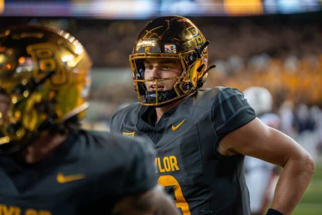 Redshirt senior quarterback Sawyer Robertson jogs off the field after a touchdown