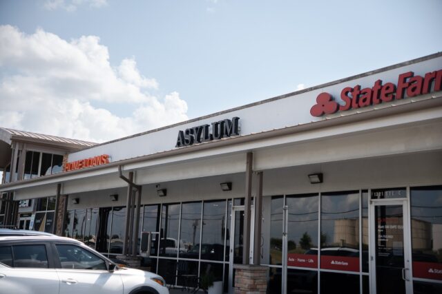 The storefront of one of two Asylum Hair Salons' locations off of Hewitt Dr. Brady Harris | Photographer
