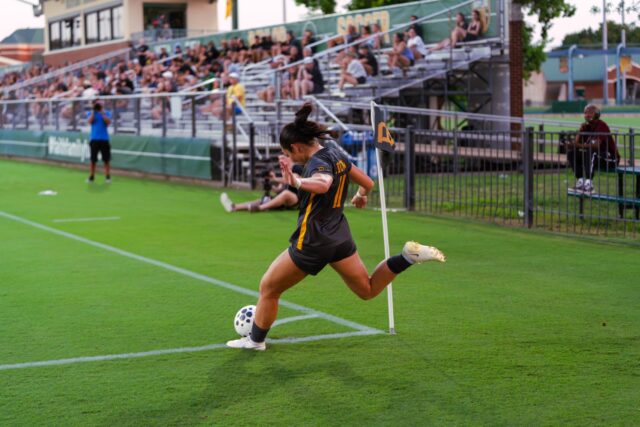 Senior Forward Tyler Isgrig launches a corner kick towards the goal in the Bears' 2-0 win against Mississippi State Thursday night at Betty Lou Mays Field. Brady Harris | Photographer