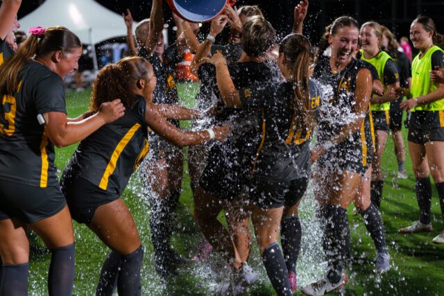 Head Coach Michelle Lenard gets a Gatorade bath from her team after securing the victory in the Bears' 2-0 win against Mississippi State Thursday night at Betty Lou Mays Field. Brady Harris | Photographer