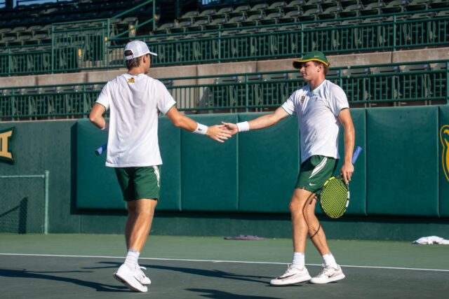 Freshmen Blake Anderson and Drew Hedgecoe celebrate after a point during their 8-6 doubles win over Abilene Christian University. Mary Thurmond | Photo Editor