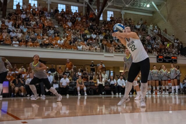 Freshman libero Morgan Madison hits a return on a serve. Mary Thurmond | Photo Editor