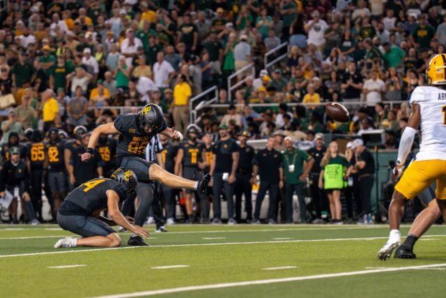 Redshirt freshman kicker Connor Hawkins successfully kicks an extra point after a Baylor touchdown. Mary Thurmond | Photo Editor