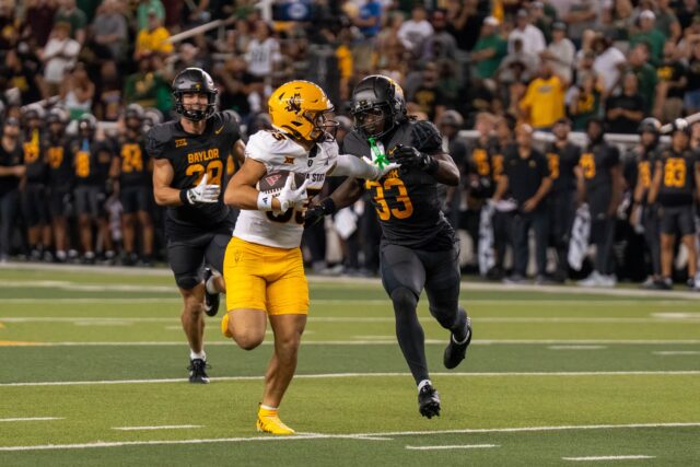 Arizona State wide receiver Derek Eusebio stiff-arms junior safety DJ Coleman during a 61-yard reception in the fourth quarter. Mary Thurmond | Photo Editor