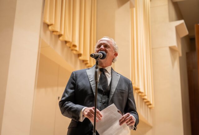 Conductor Jeffrey D. Grogan addresses the crowd, and introduces the Baylor Symphony Orchestra at the Jones Concert Hall on Monday. Sam Gassaway | Photographer
