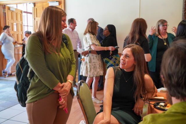 Professors and administration of Baylor chat and eat together at the Faculty and Staff of Color Reception at Truett Seminary on Thursday Evening. Caleb Garcia | Photographer