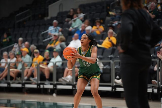 Freshman Guard Marcayla Johnson prepares to shoot a three-pointer at the Women's Basketball Media Day and Open Practice on Monday afternoon at Foster Pavilion. Caleb Garcia | Photographer