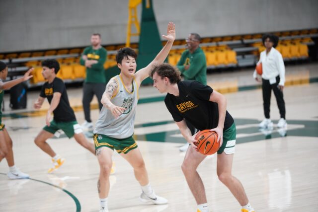 Sophomore Guard Yuting Deng guards against a member of the practice squad at the Women's Basketball Media Day and Open Practice on Monday afternoon at Foster Pavilion. Caleb Garcia | Photographer