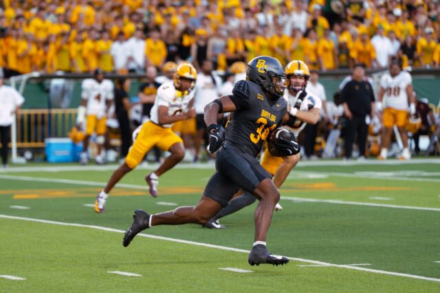 Redshirt senior wide receiver Josh Cameron catches a pass and runs into the secondary. Brady Harris | Photographer
