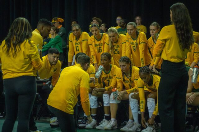 Coach Ryan McGuyre debriefs his players during the Bears' 3-2 victory over TCU at the Ferrell Center on Saturday. Sam Gassaway | Photographer
