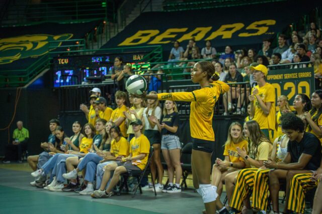 Junior middle blocker Victoria Davis prepares to serve the ball during the Bears' 3-2 victory over TCU at the Ferrell Center on Saturday. Sam Gassaway | Photographer
