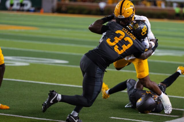 Junior safety DJ Coleman lays a big hit on the ball-carrier. Brady Harris | Photographer