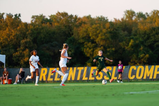 Junior Forward Lauren Omholt winds up to make a shot on the goal in their 1-0 win against UT Thursday night at Betty Lou Mays Field. Brady Harris | Photographer