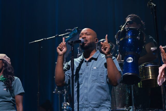 Brandon Winbush, one of Lauren Daigle&squot;s talented backup singers, providing support during the song "Waiting" Friday night at Baylor&squot;s Foster Pavilion. Brady Harris | Photographer