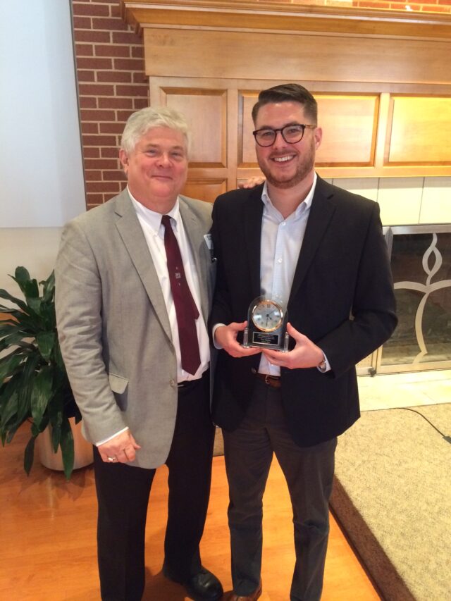 Van Darden poses with his father, Robert, as he accepts the award for Outstanding Young Alum from Baylor University Department of Journalism, Public Relations and New Media in Jan. 2016. Photo courtesy of Robert Darden