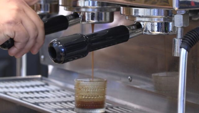 An employee at Mila Café pours a shot of espresso. Jacob Stowers | Broadcast Reporter