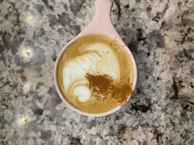 Dichotomy’s “Remember Me” latte, featuring pumpkin spice with a hint of chocolate. The latte features a cute witches hat latte art design.