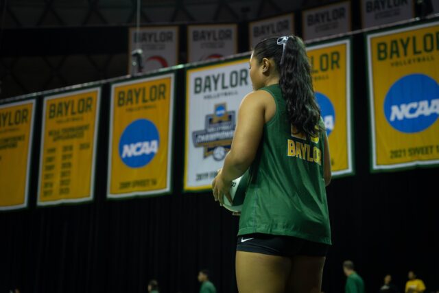 Junior defensive specialist Tehani Ulufatu prepares to serve during the Bears' 3-0 victory over Houston at the Ferrell Center on Wednesday. Sam Gassaway | Photographer