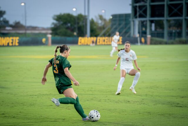 Junior defensive midfielder Natalie Vatter passes the ball during the Bears' 3-0 victory over Iowa State at Betty Lou Mays Field on Thursday. Sam Gassaway | Photographer