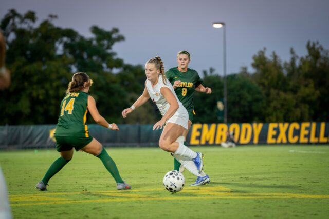 Junior forward Callie Conrad and junior midfielder Theresa McCullough fight for control of the ball with Iowa State's redshirt junior defensive midfielder Ella Zimmerman. Sam Gassaway | Photographer