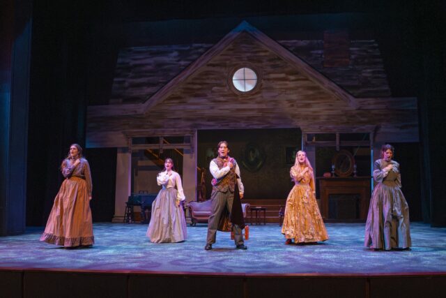 Laurie Laurence (Junior Walker DeBord, middle) joins the March sisters, Meg (Senior Audrey Meece, far left), Amy (Senior Bekah Dunning, middle left), Jo (Senior Tori Hedlund, left), Beth (Senior Ashling DeGraaf, middle right), and Jo (Senior Tori Hedlund, far right) during the “Five Forever” number. Jake Schroeder | Photographer
