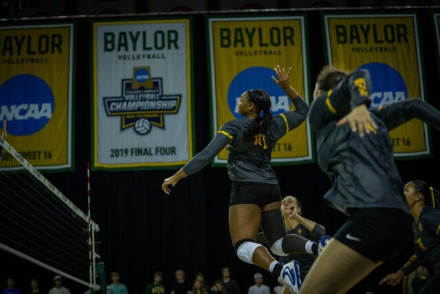 Graduate middle blocker Gabrielle Essix prepares to return the ball during the Bears' 3-1 victory over Kansas State at the Ferrell Center on Wednesday. Sam Gassaway | Photographer