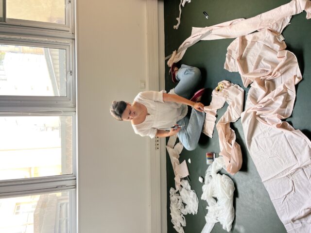 Reynolds works on fabric manipulation techniques as part of her couture craftsmanship course. The hands-on process emphasized slowing down and honoring the tactile nature of garment creation.
