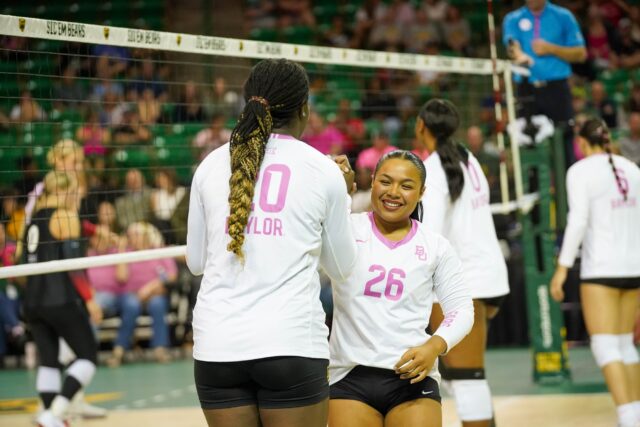 Graduate student middle blocker Manuela Bibinbe and Junior Libero Tehani Ulufatu celebrate afterbat the Baylor vs Cincinnati University Volleyball Game on Friday evening at the Ferrell Center. Caleb Garcia | Photographer