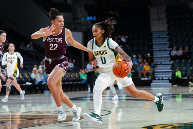 Redshirt sophomore guard Taliah Scott dribbles past the defense towards the basket. Brady Harirs | Photographer