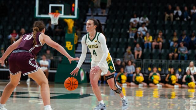 Graduate student guard Jana Van Gytenbeek dribbles her way past a defender. Brady Harris | Photographer
