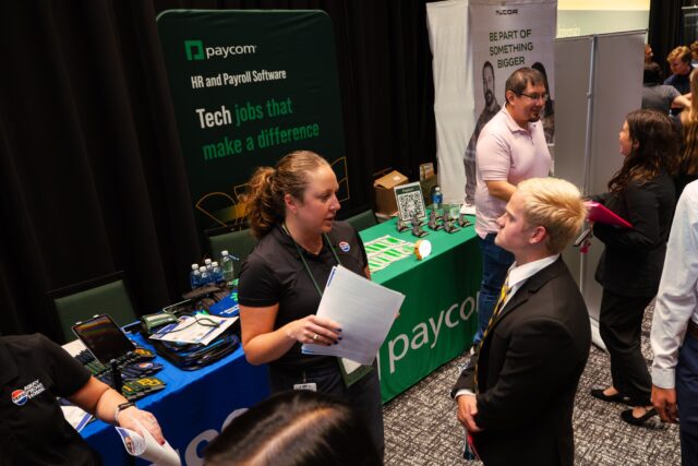 Dallas junior Luke Dumas speaking with a recruiter from Pepsico