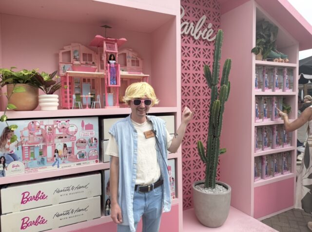 Brandon Manly, a retail specialist for Magnolia, dresses as Ken in front of the Barbie Hearth & Hand Townhouse display during Silobration on Oct. 23, 2025, in Waco, Texas. The themed installation launched Magnolia’s new collaboration with Mattel, featuring a Joanna Gaines-inspired Barbie doll and dollhouse.