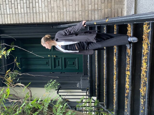 Savage poses in one of her fully thrifted outfits | Photo courtesy of Audrey Savage