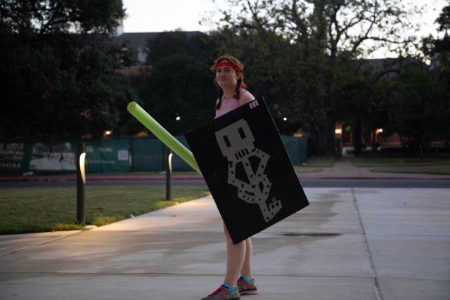 Houston junior Elaine Adams, the "Dolores Umbridge" alpha, waits outside the HRC early Tuesday morning.