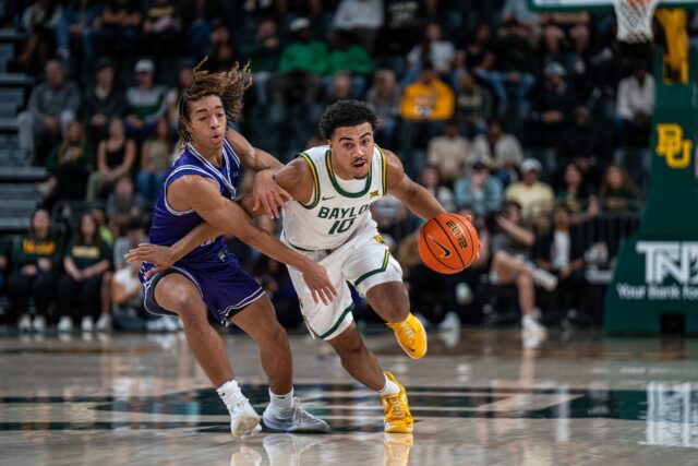 Sophomore guard Isaac Williams IV drives down the court during the Bears' 94-81 win against Tarleton State. Alyssa Meyers | Photographer