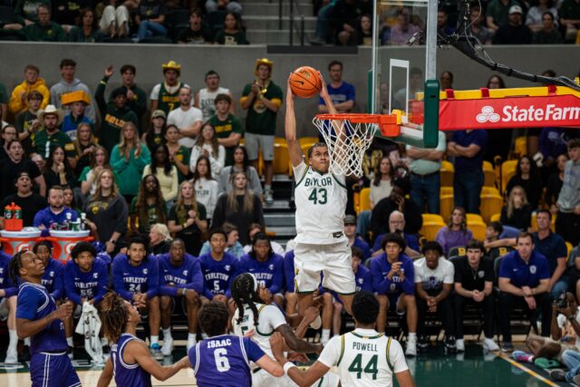 Redshirt sophomore guard Cameron Carr goes for the dunk against the Bears' Friday night win against Tarleton State. Alyssa Meyers | Photographer