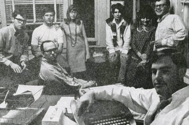 1966 Baylor Lariat staff members gather around a typewriter. Courtesy of Preston Kirk.