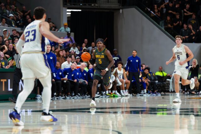 Fifth-year senior guard Obi Agbim takes the ball up court and commands the offense. Brady Harris | Photographer