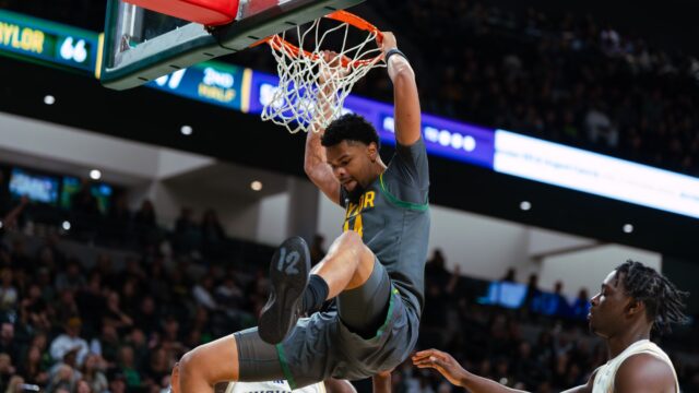 Senior center Caden Powell slams one in after a rebound. Brady Harris | Photographer