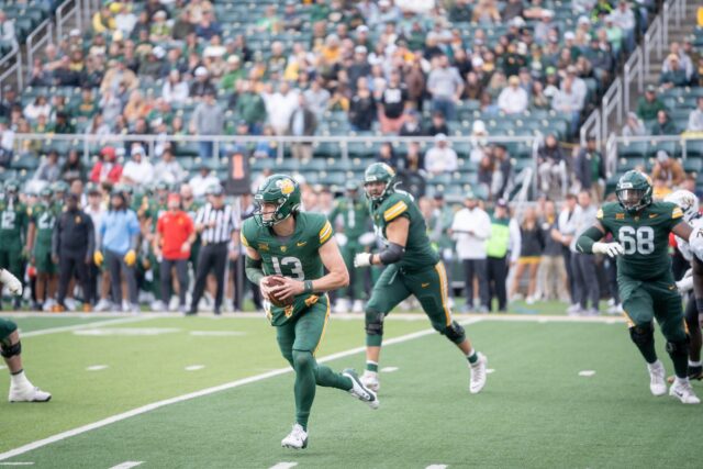 Redshirt senior quarterback Sawyer Robertson runs the ball during the Bears' 30-3 victory over UCF at McLane Stadium on Saturday. Sam Gassaway | Photographer