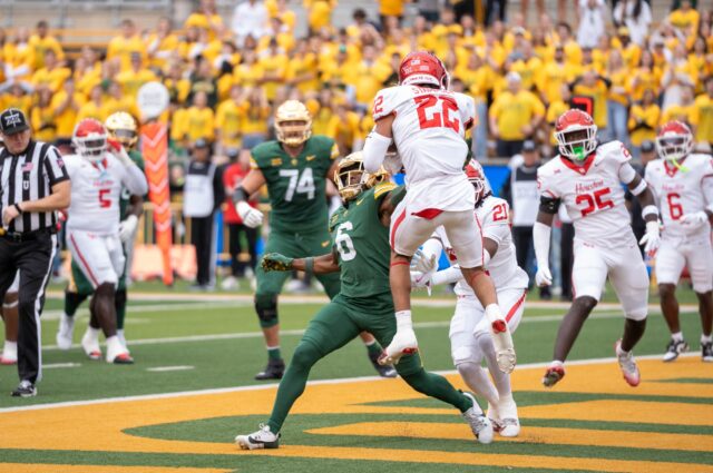 Houston senior defensive back Marc Stampley II intercepts a pass intended for sixth year wide receiver Ashtyn Hawkins ...