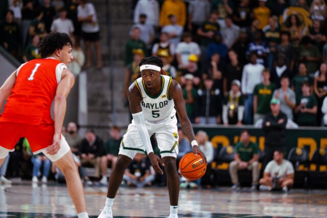 5th-year senior guard Obi Agbim takes charge of the offense at the top of the key. Brady Harris | Photographer