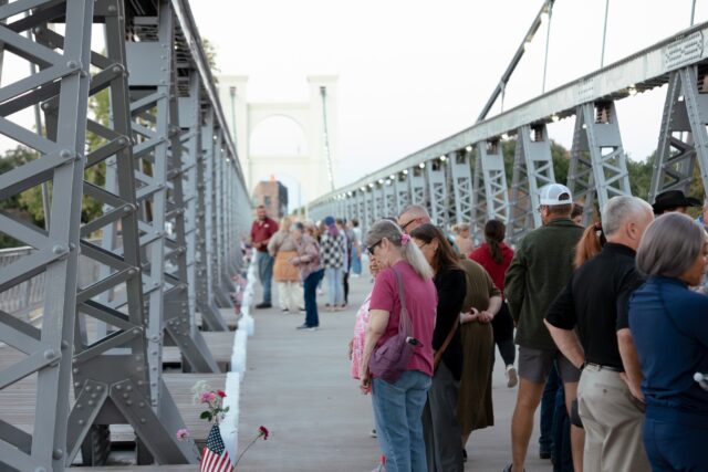 Attendees of the Lights of Love reflecting in remembrance of their loved ones with luminaries. Brady Harris | Photographer