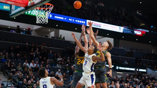 A group of Bears' led by senior guard Dan Skillings Jr., fight for an offensive rebound. Brady Harris | Photographer