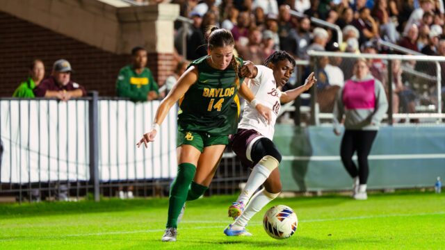Junior forward Theresa McCullough fights with a defender for the ball. Brady Harris | Photographer