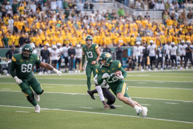 Freshman running back Caden Knighten squeeks past a defender and pulls Baylor into the red zone during the Bears' 30-3 win over UCF Saturday at McLane Stadium. Sam Gassaway | Photographer