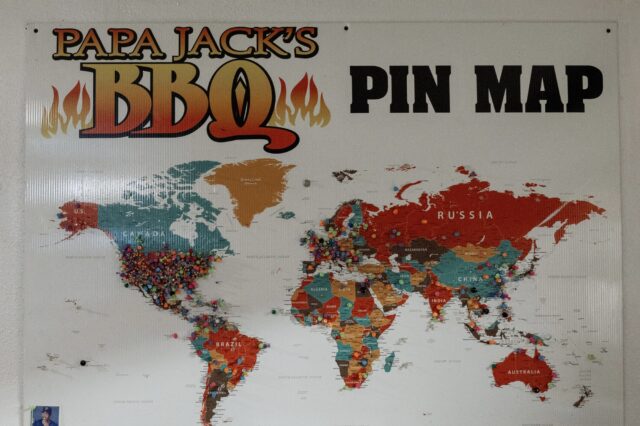 A world map pinned with visitors’ home countries hangs inside the restaurant. Guests have traveled from as far as Spain and Australia to eat at Papa Jack's BBQ. Courtesy of Reece Reiling.